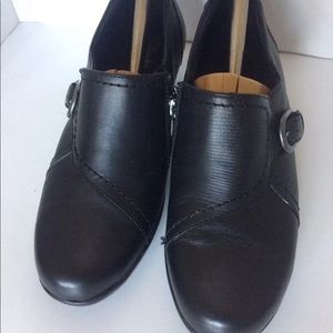 Clark’s bendable black leather shoes